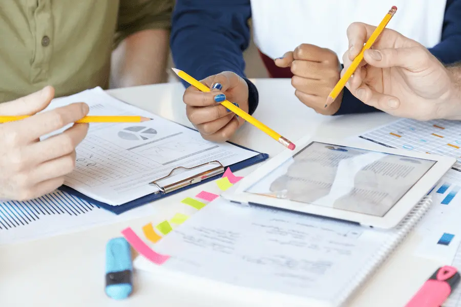 Professionals collaborating around project documents